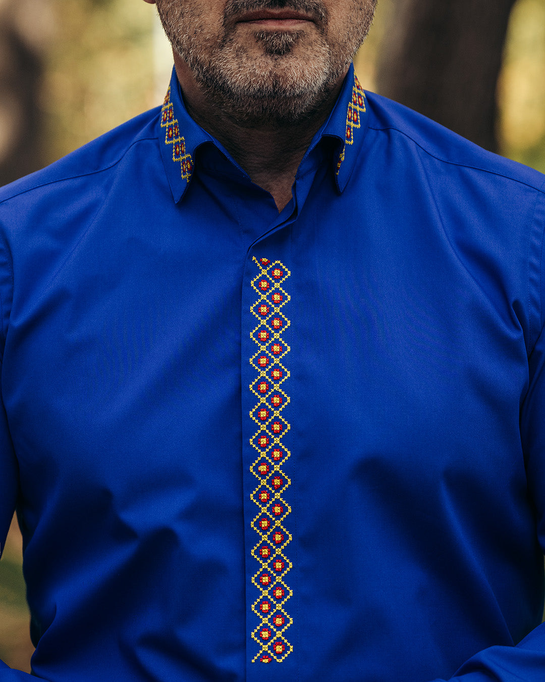 Men's casual blue shirt with traditional red-yellow embroidered motifs Merer