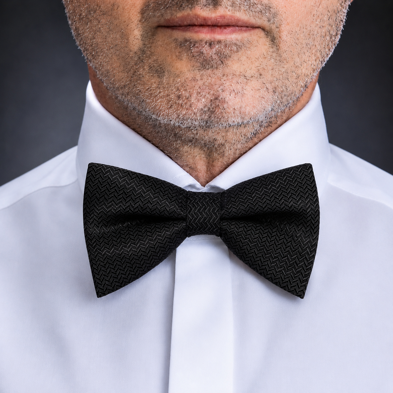 Black bow tie with fine polka dots