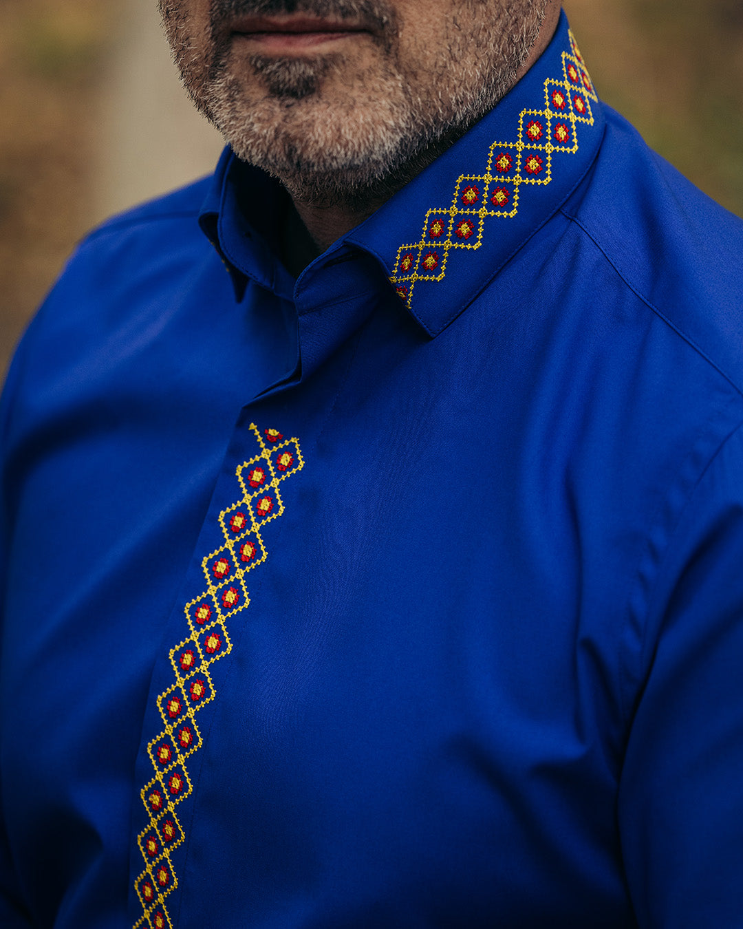 Men's casual blue shirt with traditional red-yellow embroidered motifs Merer