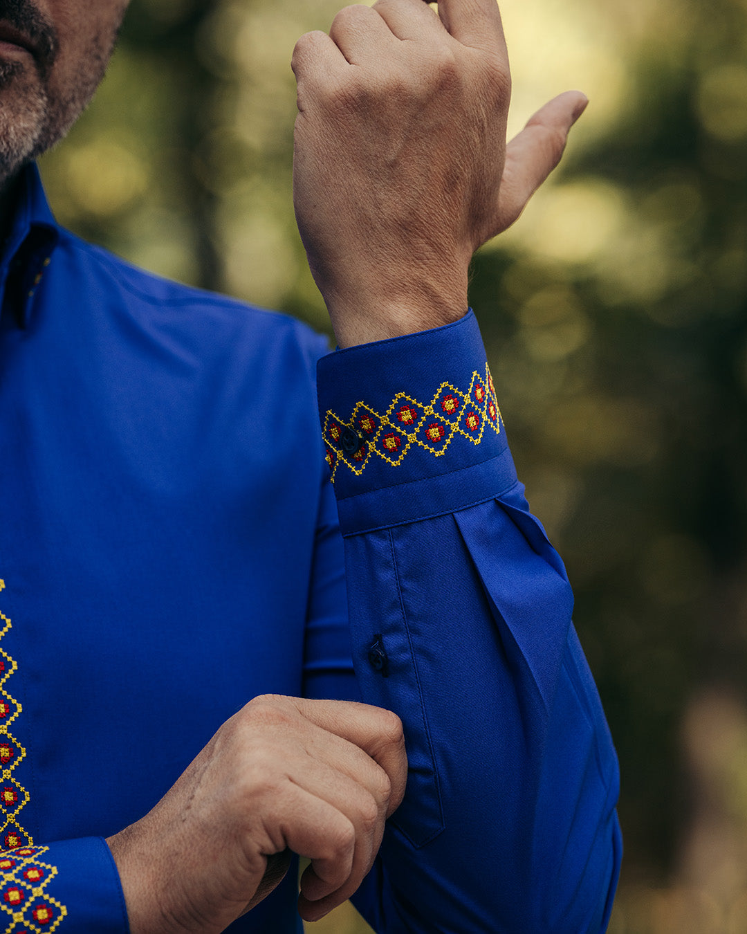 Men's casual blue shirt with traditional red-yellow embroidered motifs Merer