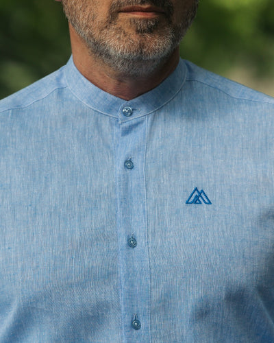 Blue IN shirt with partial slit and Merer logo